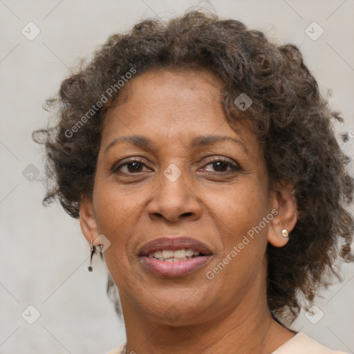 Joyful black adult female with short  brown hair and brown eyes