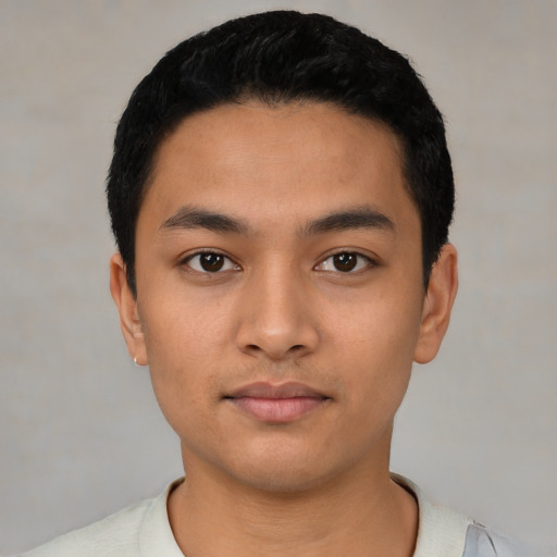 Neutral latino young-adult male with short  black hair and brown eyes
