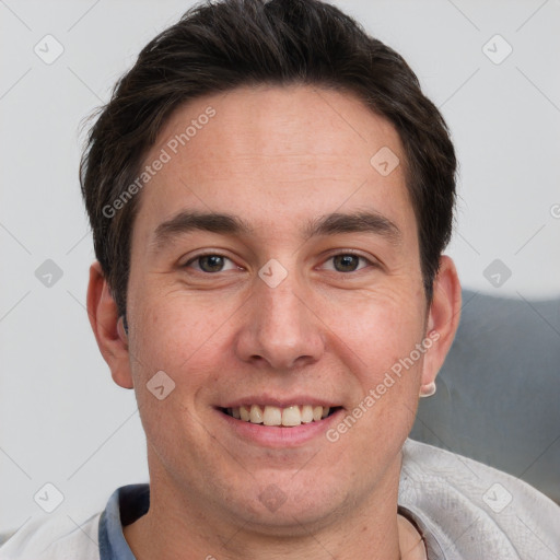 Joyful white adult male with short  brown hair and brown eyes