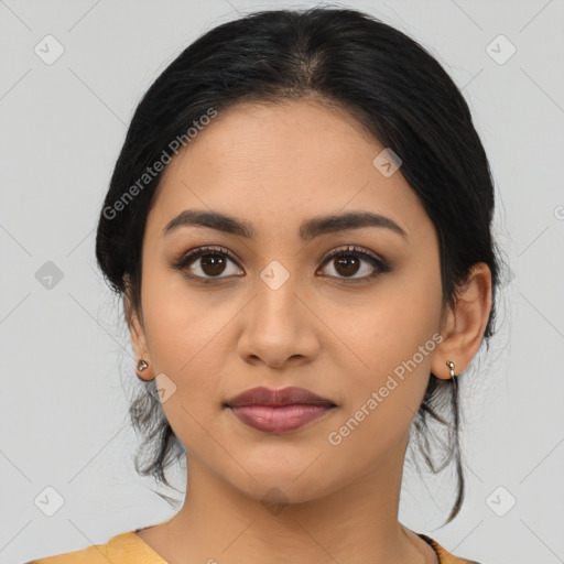 Joyful latino young-adult female with medium  black hair and brown eyes