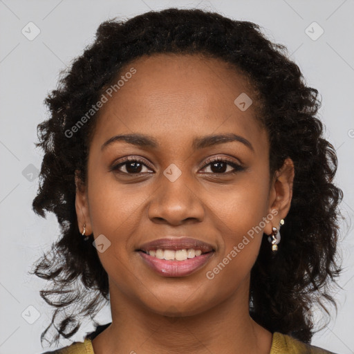 Joyful black young-adult female with long  brown hair and brown eyes