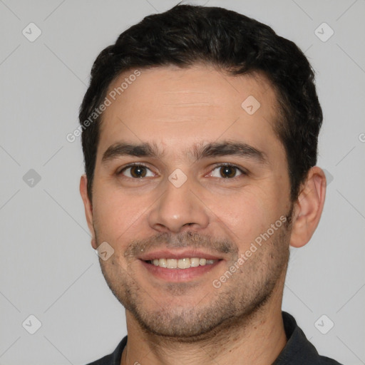 Joyful white young-adult male with short  black hair and brown eyes