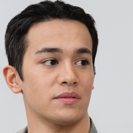Neutral asian young-adult male with short  brown hair and brown eyes