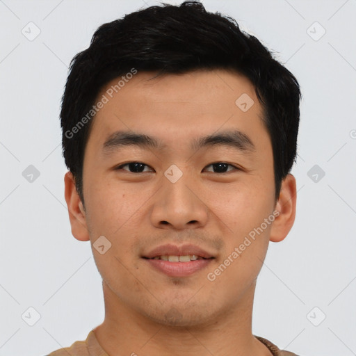 Joyful asian young-adult male with short  black hair and brown eyes