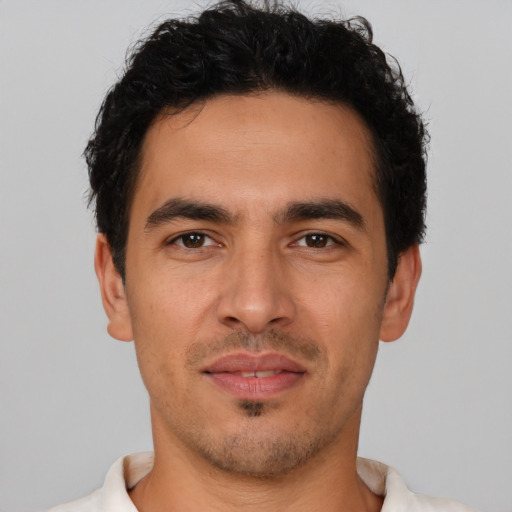 Neutral latino young-adult male with short  brown hair and brown eyes