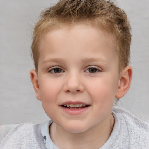 Joyful white child male with short  brown hair and brown eyes