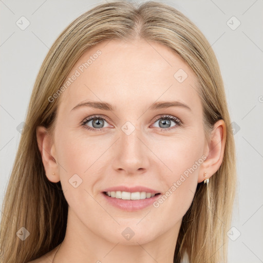 Joyful white young-adult female with long  brown hair and blue eyes