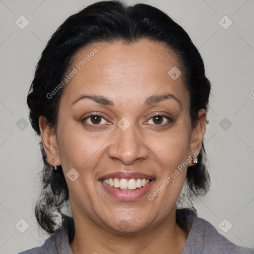 Joyful latino adult female with medium  brown hair and brown eyes