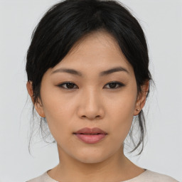 Neutral asian young-adult female with medium  brown hair and brown eyes