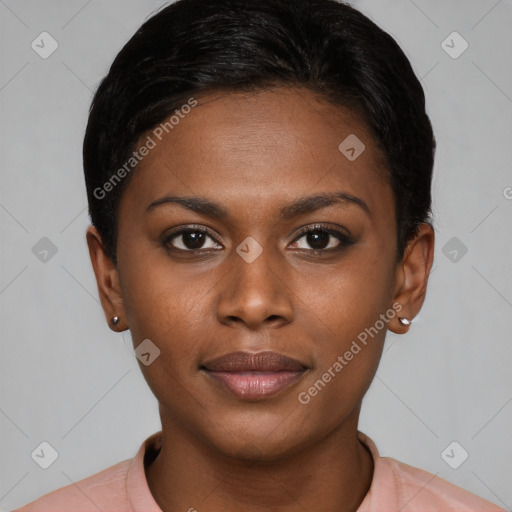 Joyful black young-adult female with short  brown hair and brown eyes