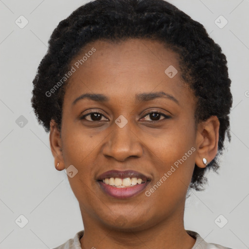 Joyful black young-adult female with short  black hair and brown eyes