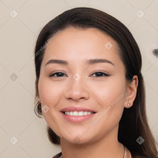 Joyful white young-adult female with long  black hair and brown eyes