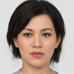 Joyful asian young-adult female with medium  black hair and brown eyes