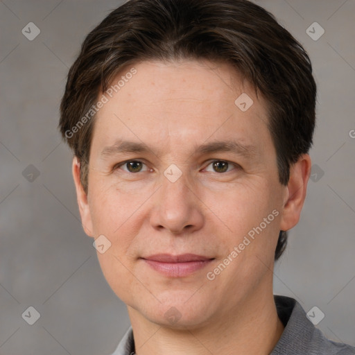 Joyful white adult male with short  brown hair and grey eyes