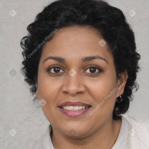 Joyful latino adult female with short  brown hair and brown eyes