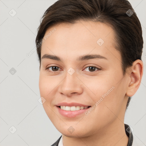 Joyful white young-adult female with short  brown hair and brown eyes