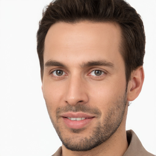 Joyful white young-adult male with short  brown hair and brown eyes