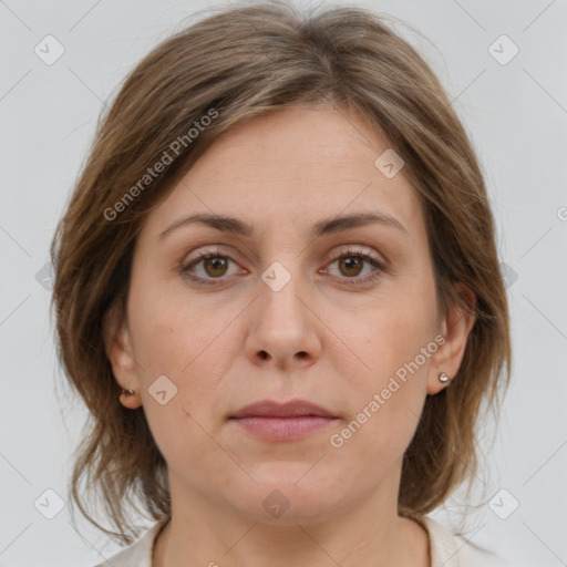 Joyful white adult female with medium  brown hair and brown eyes