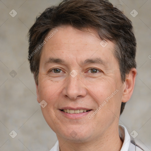 Joyful white adult male with short  brown hair and brown eyes