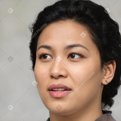 Joyful asian young-adult female with medium  black hair and brown eyes