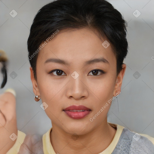 Joyful asian young-adult female with short  brown hair and brown eyes