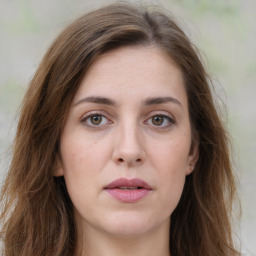 Joyful white young-adult female with long  brown hair and green eyes