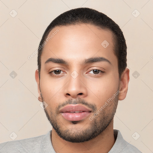 Neutral latino young-adult male with short  black hair and brown eyes