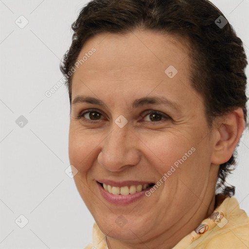 Joyful white adult female with short  brown hair and brown eyes