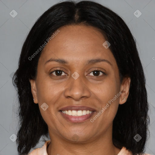 Joyful black adult female with medium  brown hair and brown eyes