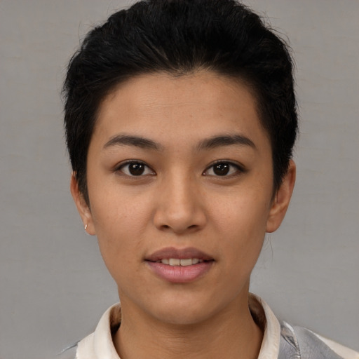 Joyful latino young-adult female with short  brown hair and brown eyes