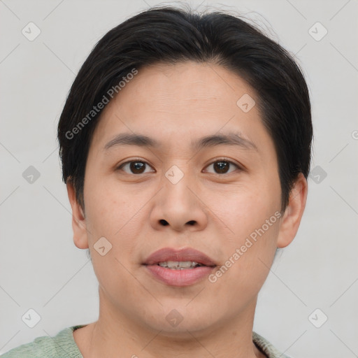 Joyful asian young-adult male with short  brown hair and brown eyes