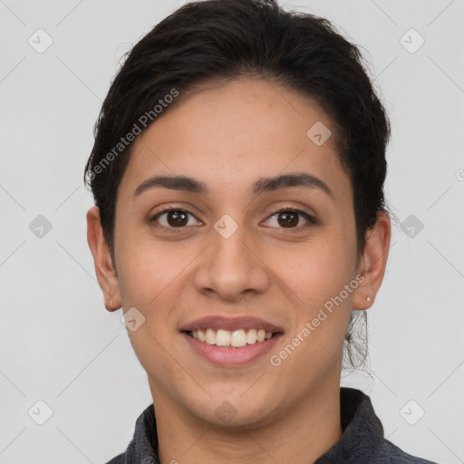 Joyful white young-adult female with short  brown hair and brown eyes