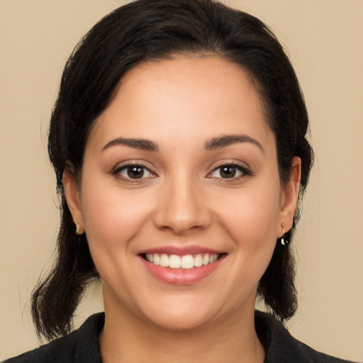 Joyful white young-adult female with medium  black hair and brown eyes