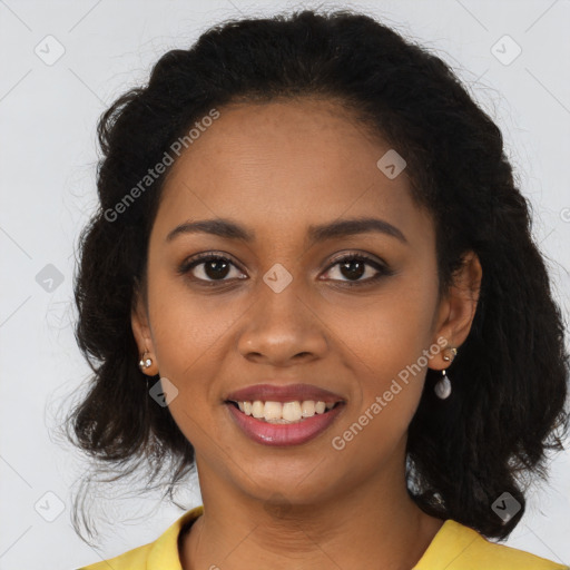 Joyful black young-adult female with long  brown hair and brown eyes