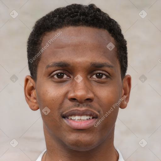 Joyful black young-adult male with short  brown hair and brown eyes