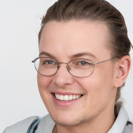 Joyful white young-adult female with short  brown hair and blue eyes