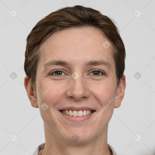 Joyful white adult female with short  brown hair and grey eyes