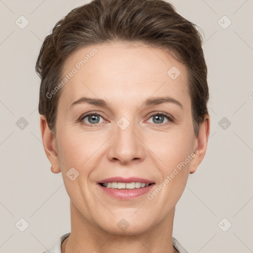 Joyful white adult female with short  brown hair and grey eyes