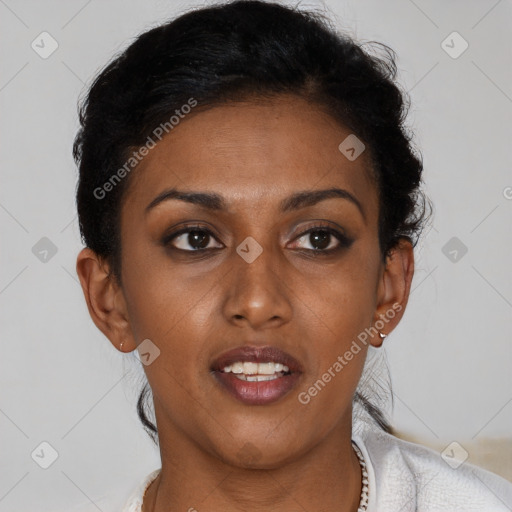 Joyful black young-adult female with short  brown hair and brown eyes