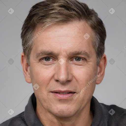 Joyful white adult male with short  brown hair and grey eyes