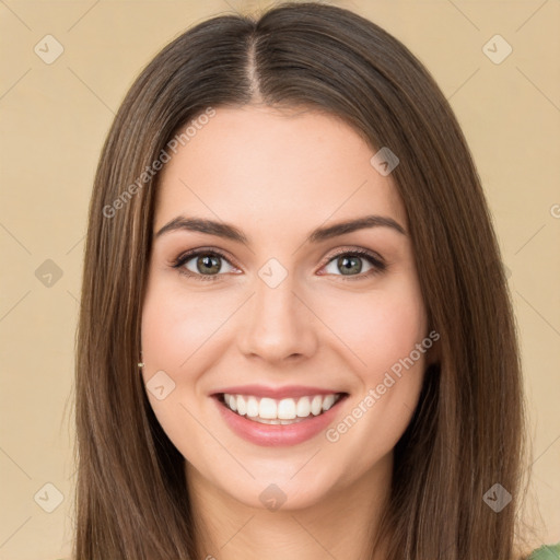 Joyful white young-adult female with long  brown hair and green eyes