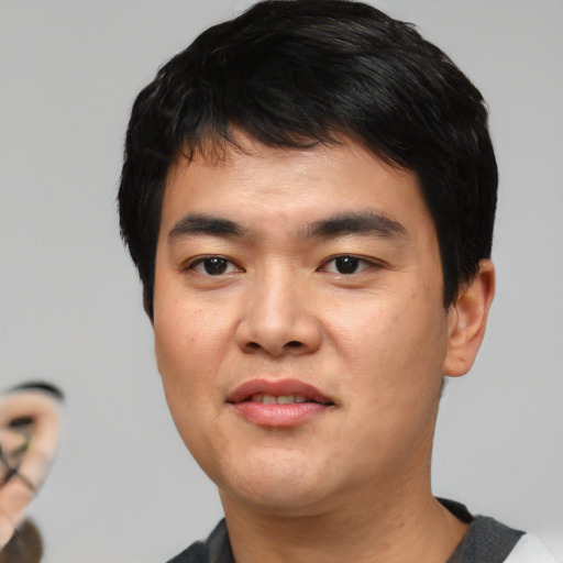 Neutral asian young-adult male with short  black hair and brown eyes