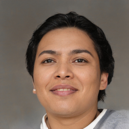 Joyful asian young-adult female with short  black hair and brown eyes