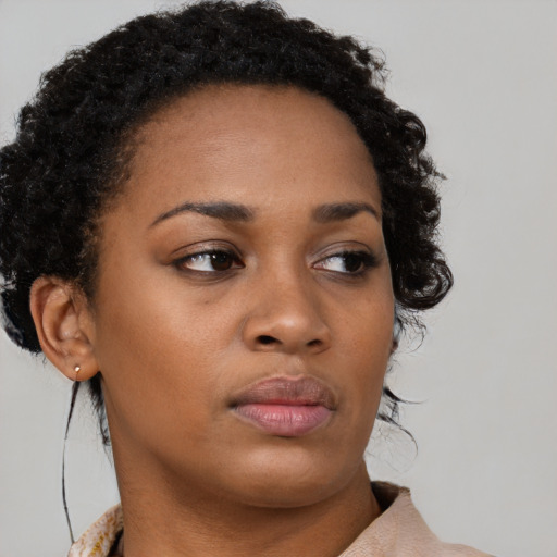 Neutral black young-adult female with short  brown hair and brown eyes