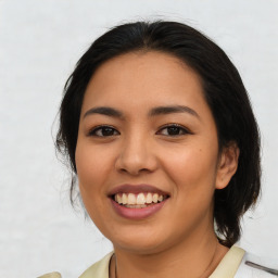 Joyful white young-adult female with medium  black hair and brown eyes