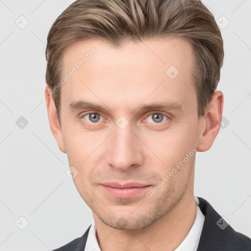 Joyful white young-adult male with short  brown hair and grey eyes