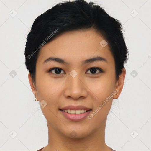 Joyful asian young-adult female with short  black hair and brown eyes