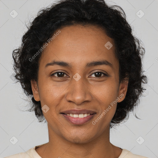 Joyful black adult female with short  brown hair and brown eyes