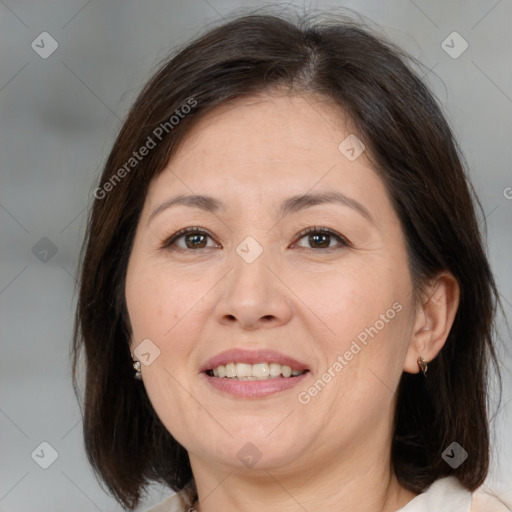 Joyful white adult female with medium  brown hair and brown eyes