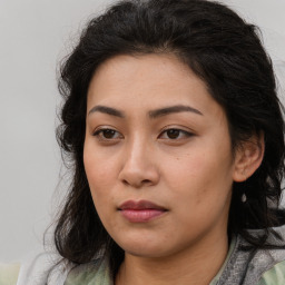 Neutral asian young-adult female with medium  brown hair and brown eyes